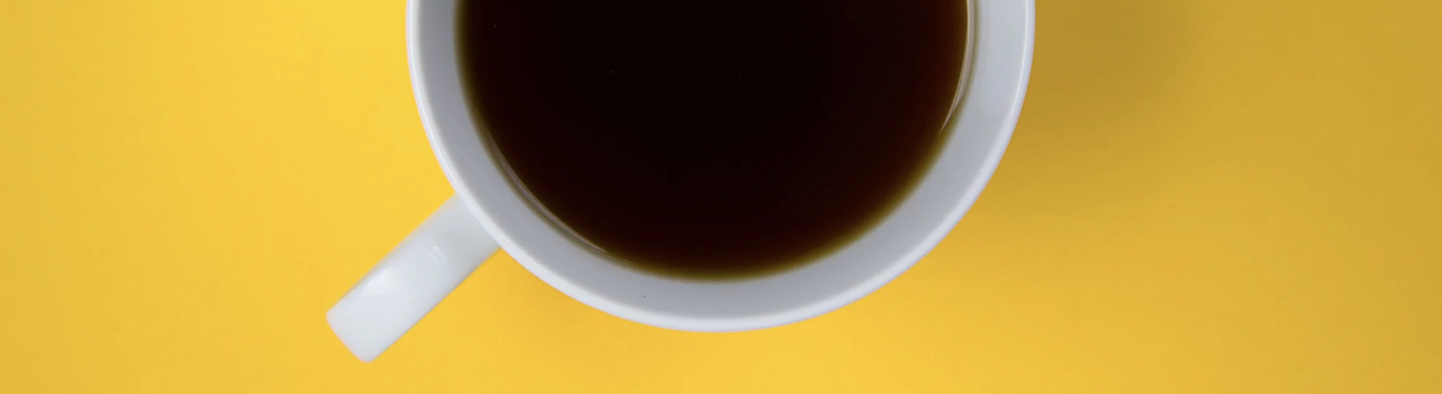 Cup on yellow background