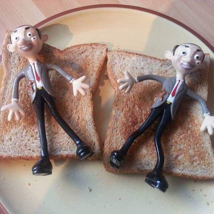 Mr bean toys laying on pieces of toast