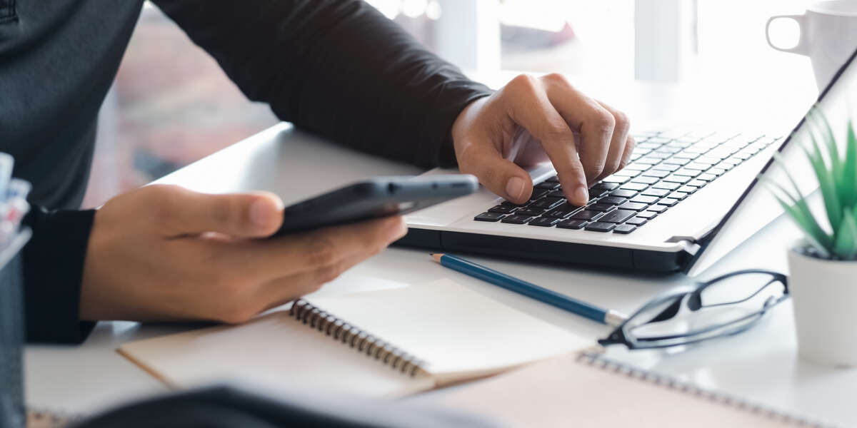 Person using laptop for contact purposes