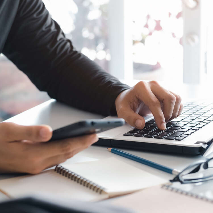 Person using laptop for contact purposes